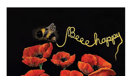 A close up image of the Bee inscribing in gold the words "Beee Happy" above a cluster of vibrant red poppies set on a contrasting black background. A digital print of an original artwork on 100% Cotton tea towels.