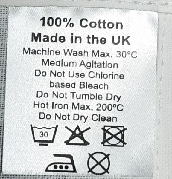 Tea towel material details and wash label.