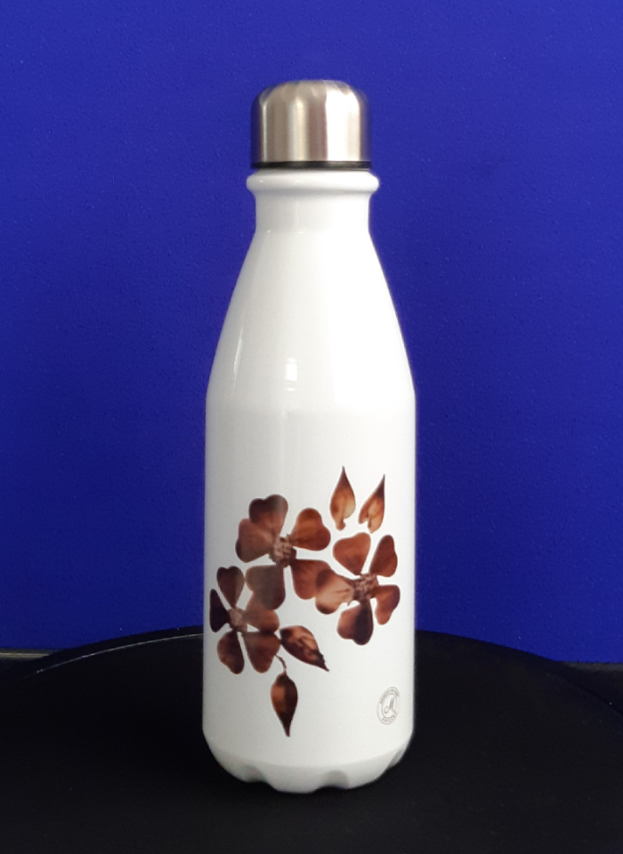 White water bottle with brown floral design on a blue background