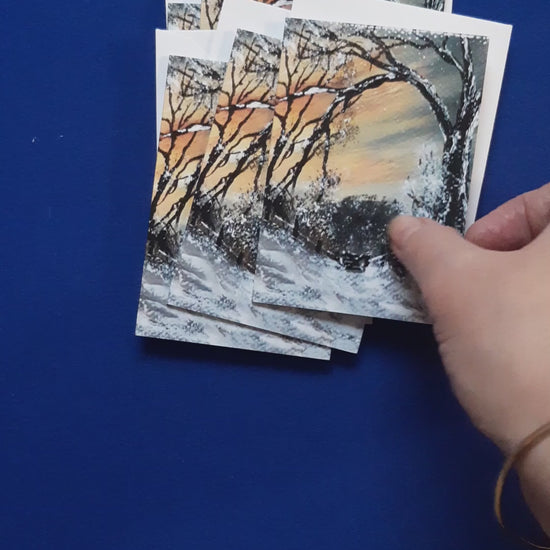 Video of card
Christmas Gift Cards - Winter Linn Gate 2
Print of an original artwork by Joanne Roberts, View of a winter woodland walk with the kissing gate ahead to walk through. Single packs of 6 cards, folded vertically on the left, includes white envelope and cello packaging. Blank inside for your personal messages and memories to be added. Small cards