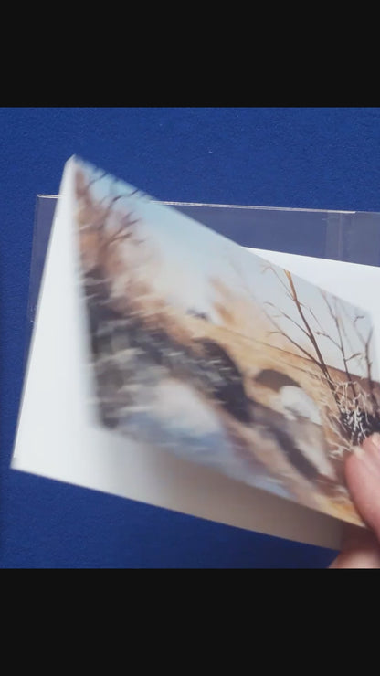 Video of card
Christmas Card, Winter Tyne Bridge
Print of an original watercolour artwork by Joanne Roberts,  Reflective winter view of the Tyne Bridge in Bellingham, in Northumberland, UK.  Single card, folded horizontally on the top, includes white envelope and cello packaging. Blank inside for your personal messages and memories to be added. Size 5 x 7 inch